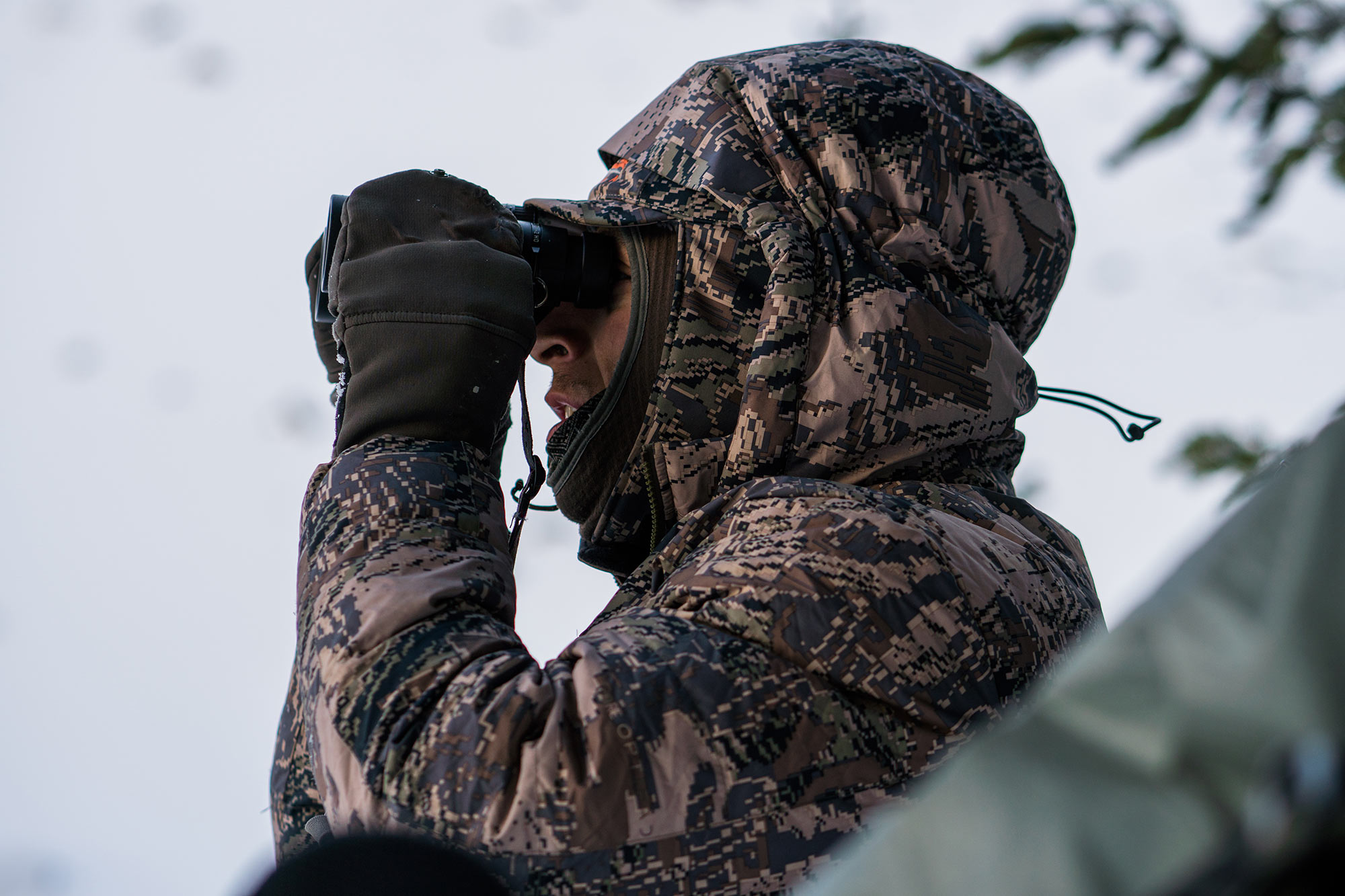 Hunter glasses in the insulated Kelvin Down Hoody.