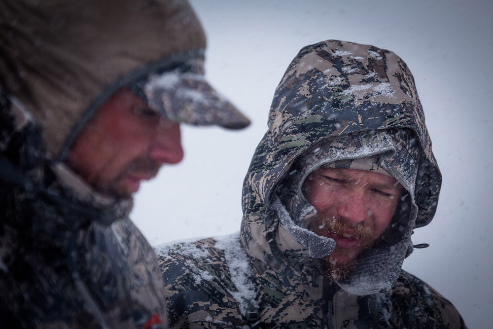 Snow pours down as hunters figure out their next move.