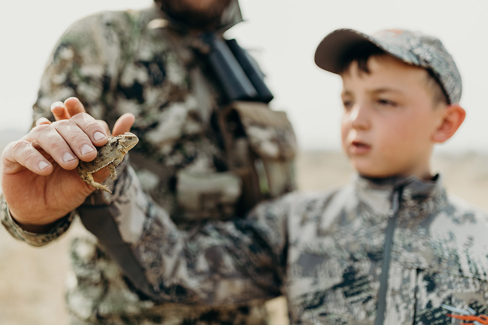 A father shows his son the larger ecosystem at play.