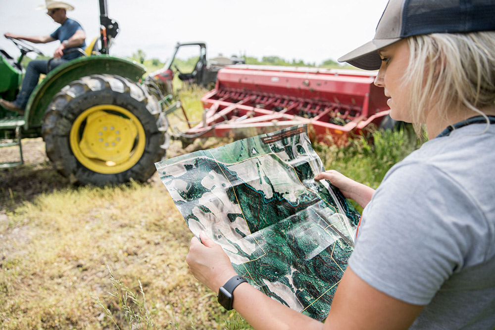 Alex Templeton studying her property.