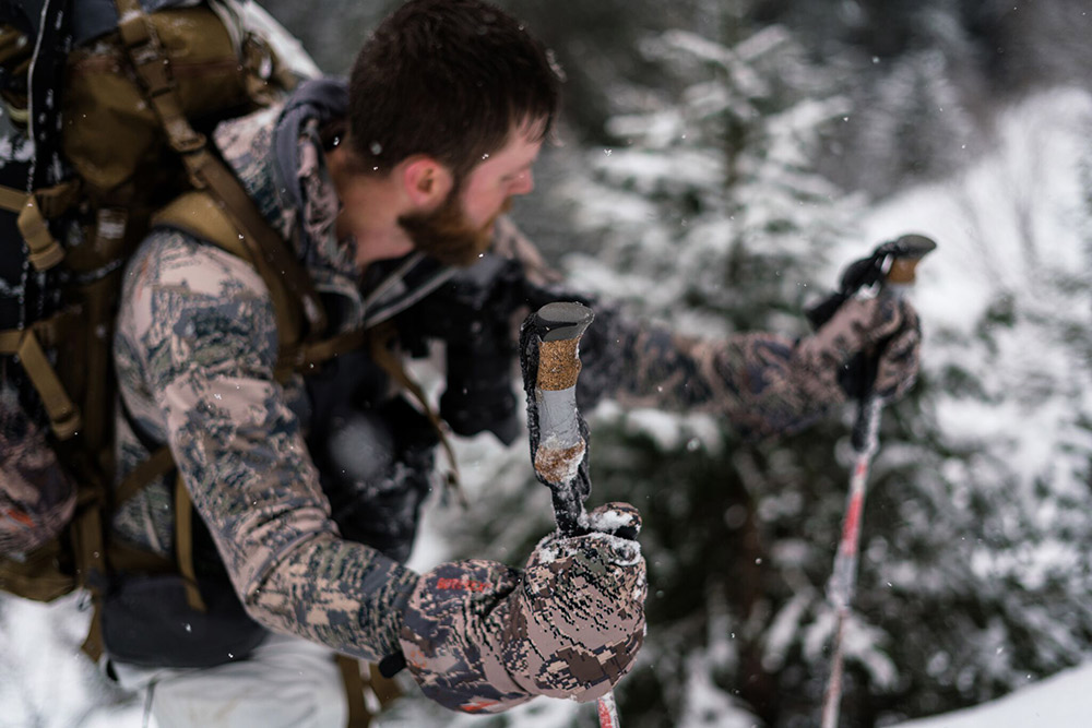 A hunter in Optifade Open Country with patched up trekking poles.