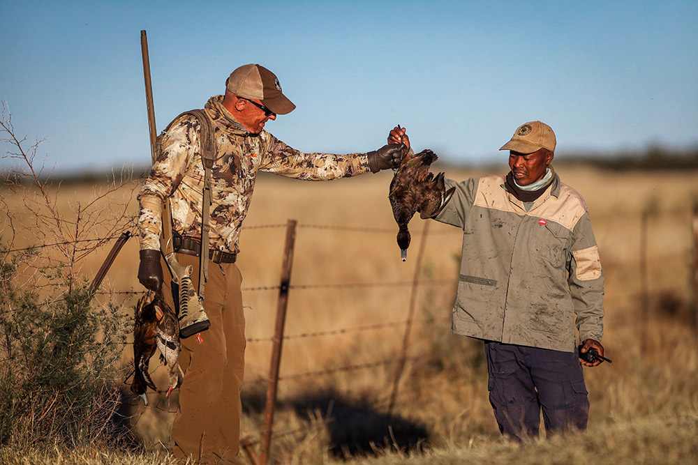 Ramsey Russell inspecting a dead bird.
