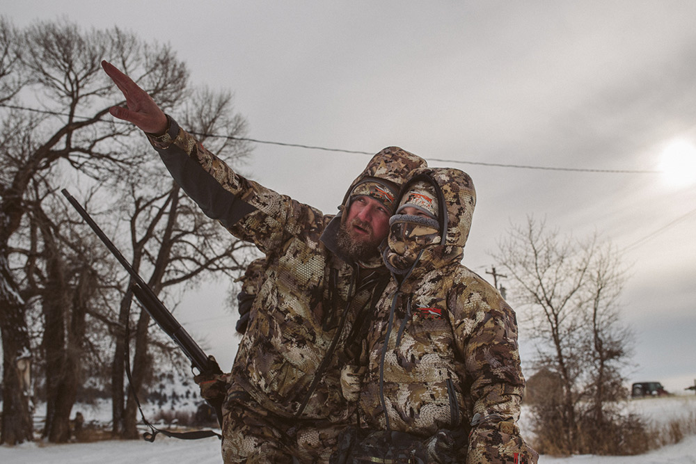 Man and son contemplating their next moves as waterfowlers.