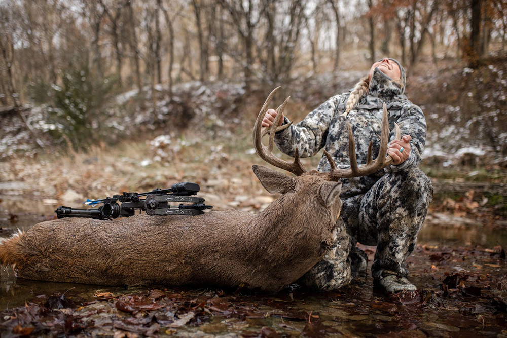 Alex Templeton overcome with emotion after shooting a nice buck with her bow.