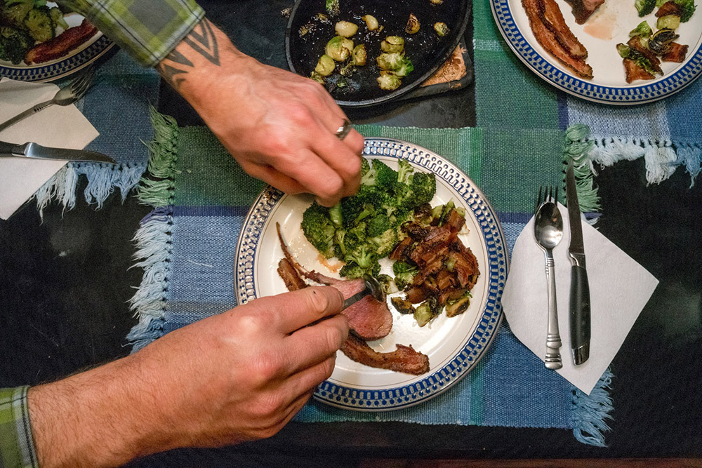 John Dudley preparing to eat his harvest.