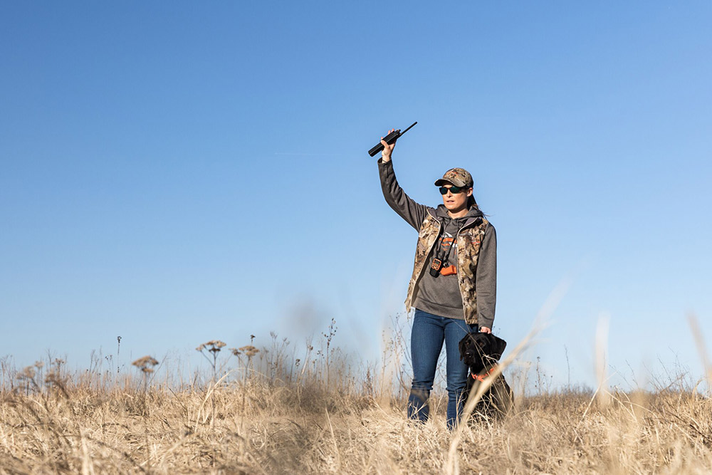Dog trainer Alex Brittingham training a lab for duck hunting.