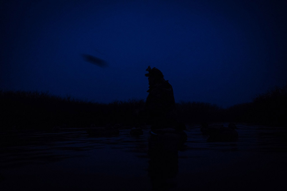 Setting up decoys in the dark.