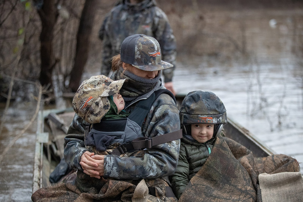 Mother and children on family duck hunt.
