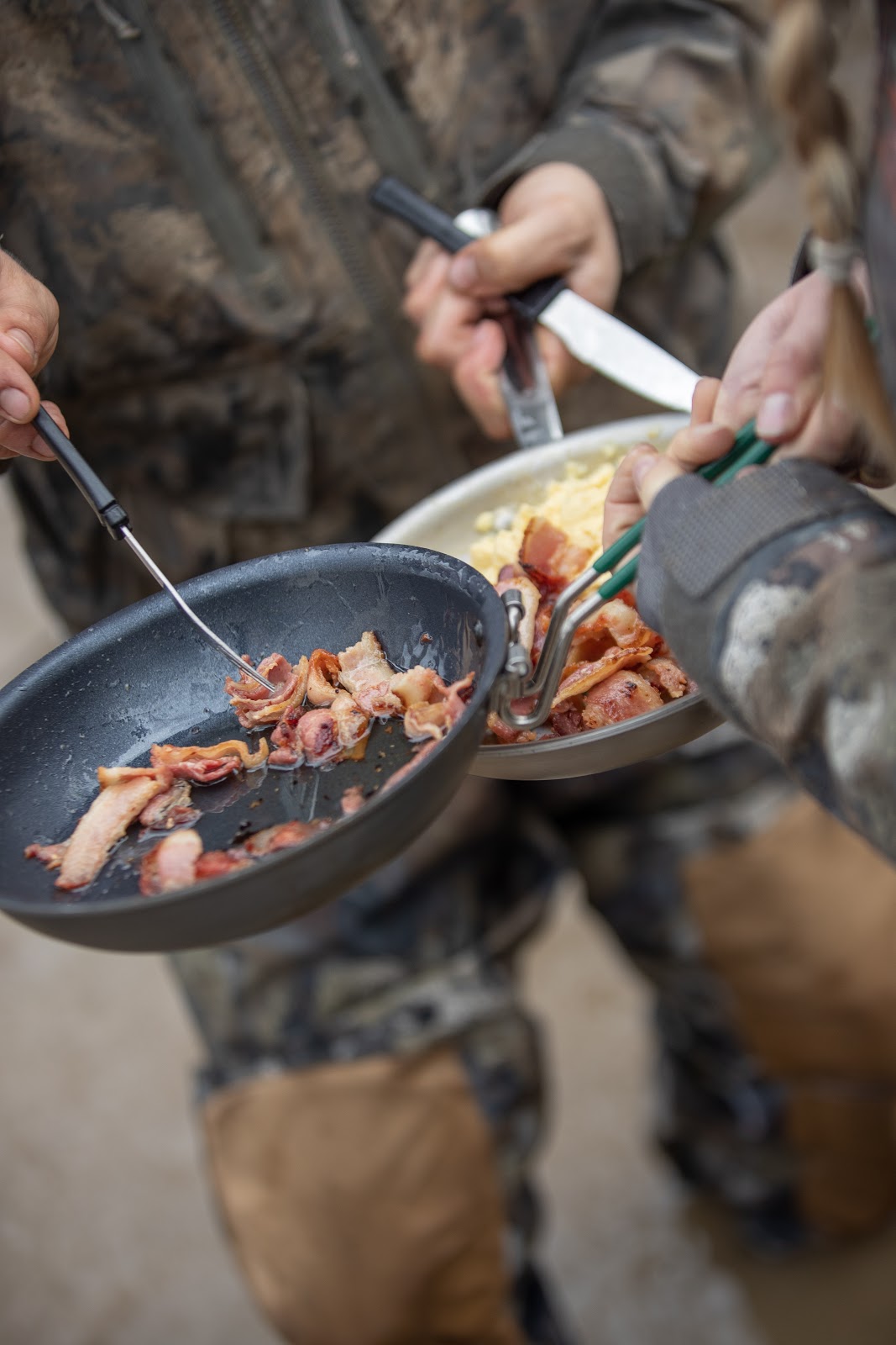 Cooking breakfast, bacon and eggs, in the duck blind.