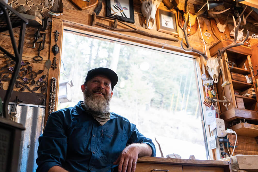Craig Krzycki sits in his home